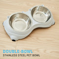 An image of the Double Stainless Steel Inclined Pet Bowl Set showing the white variant placed on the floor, the product has a built-in incline