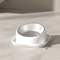An image of the Ergonomic Tilted Pet Bowl showing the white variant placed on the floor, the product has a built-in 45 degree tilt