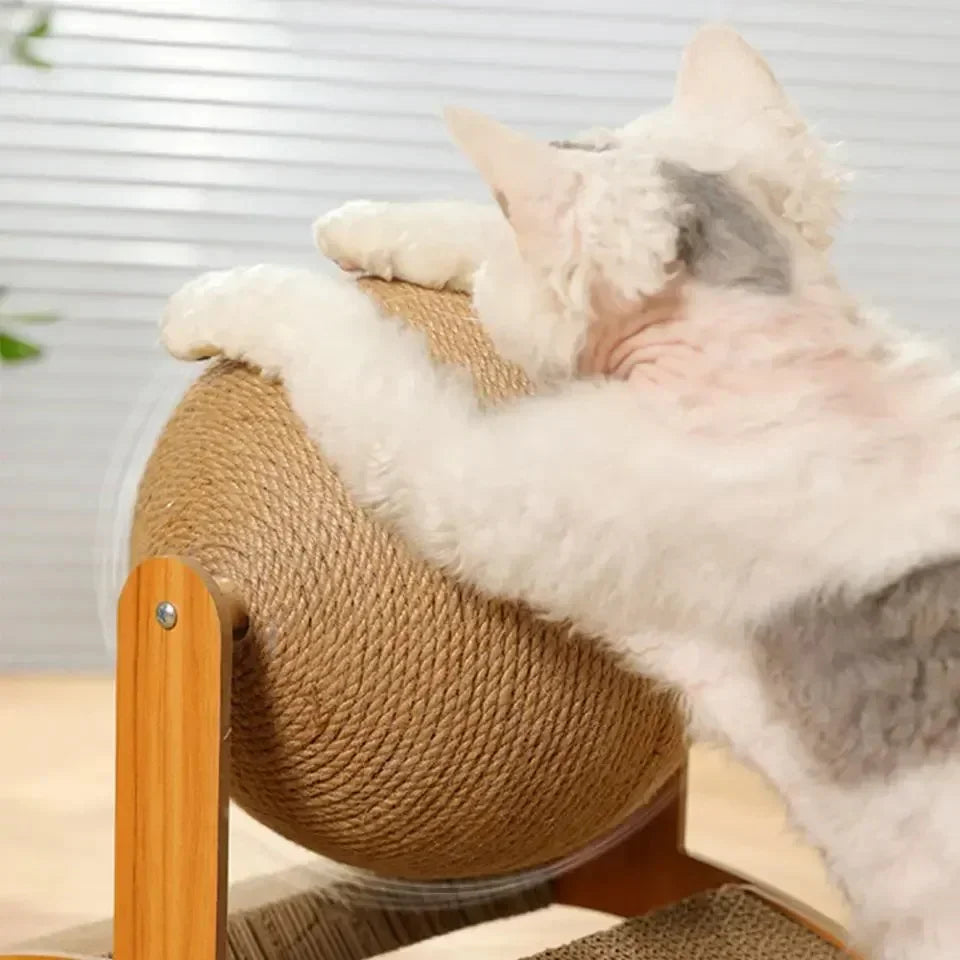 A cat playing with the sisal wrapped ball on the Inclined Cat Scratcher with Sisal Ball