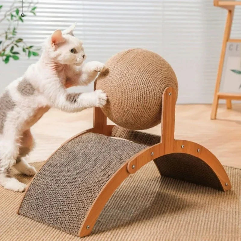 A cat playing with the sisal wrapped ball on the Inclined Cat Scratcher with Sisal Ball