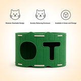 Green modular cat house shown on a light beige background with three feature icons and text above: modular stackable design, anxiety-reducing enclosure, and available in green and orange.