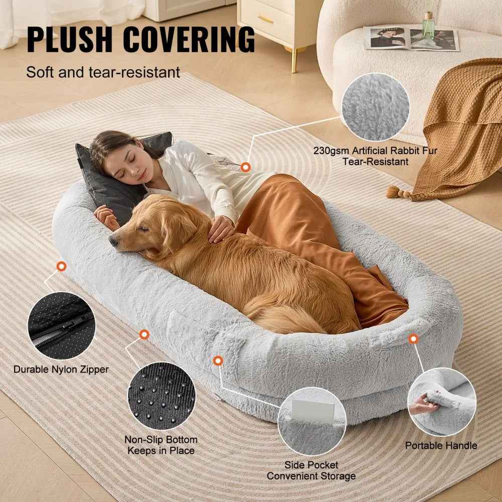 Woman lying on a plush pet bed with a dog, surrounded by features of the product.