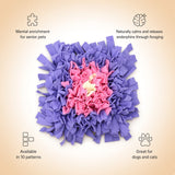 A top-down view of a purple and pink snuffle mat with a small cream-colored center, surrounded by informational text overlays on a beige gradient background.
